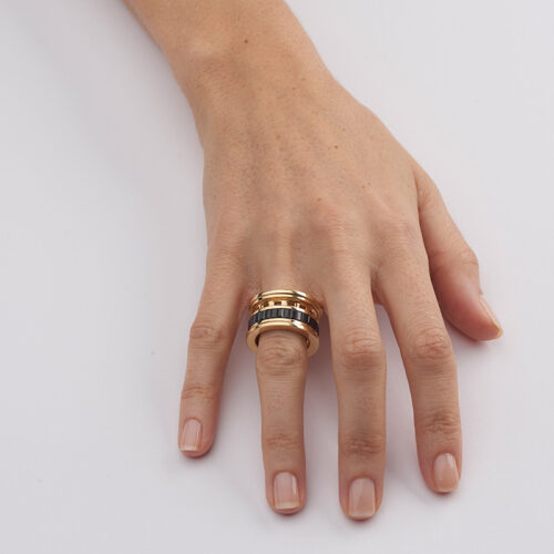 model wearing gold and sapphire cocktail ring