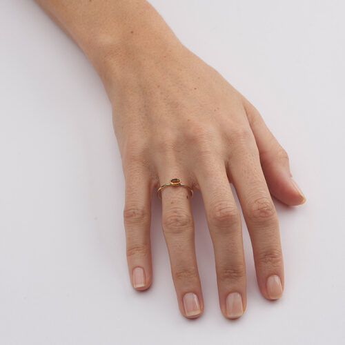model wearing yellow gold and citrine ring