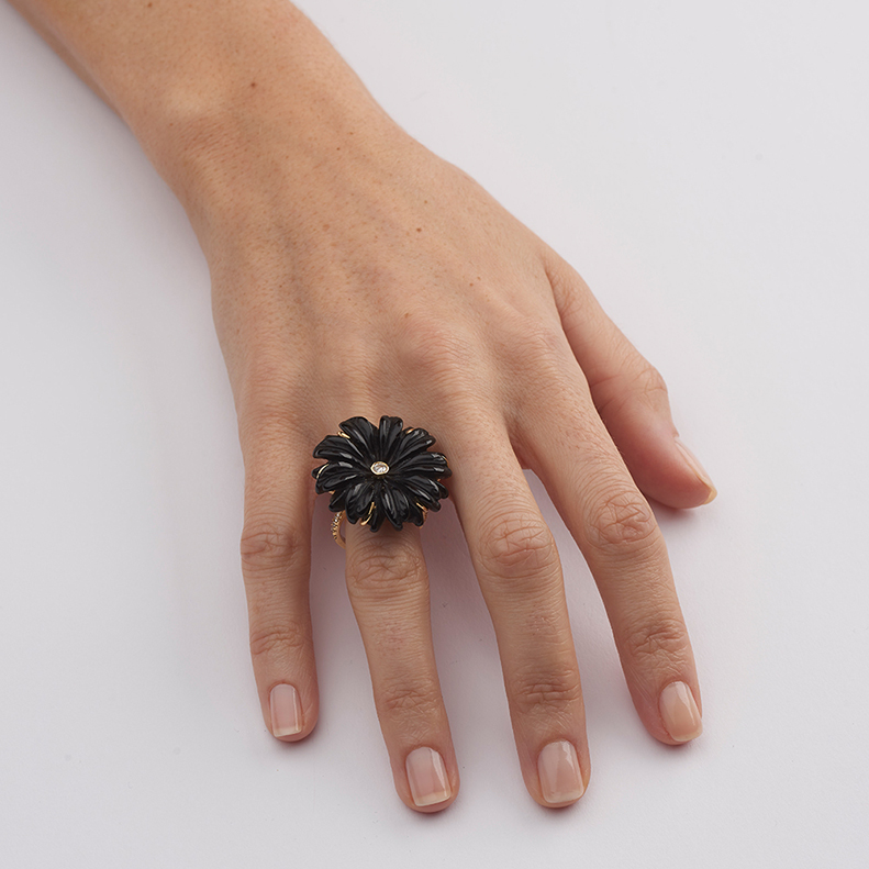 model wearing carved black onyx cocktail ring