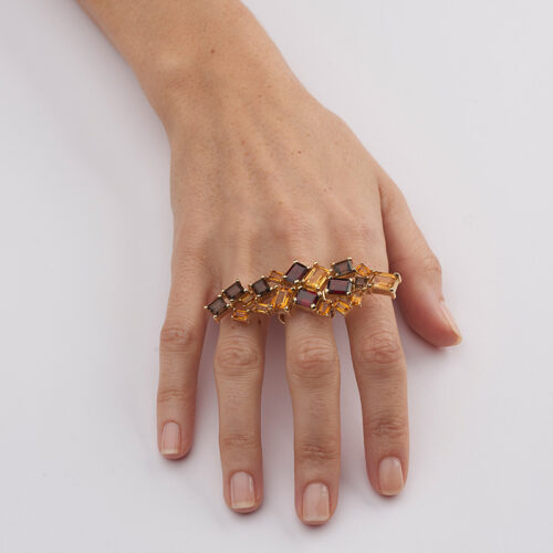 model wearing large gemstone knuckle duster ring