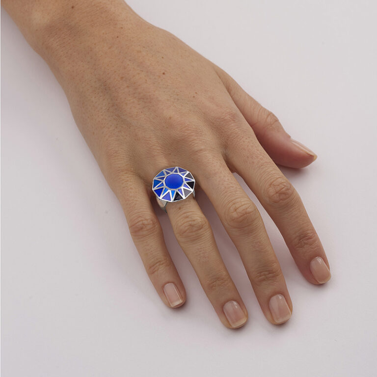 model wearing blue enamel cocktail ring