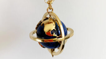 spinning world globe pendant with gold chain