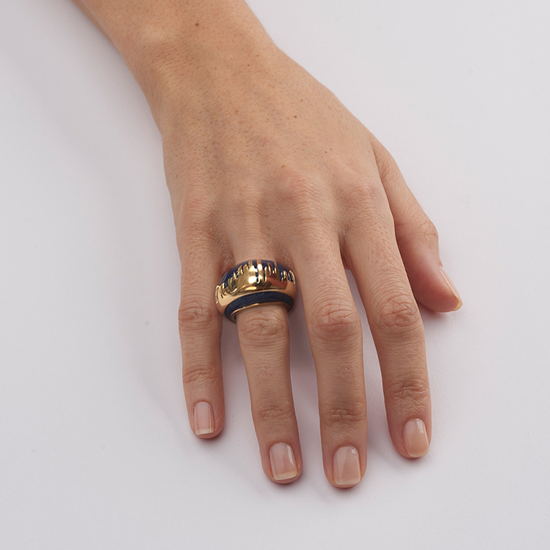 model wearing yellow gold and lapis lazuli cocktail ring