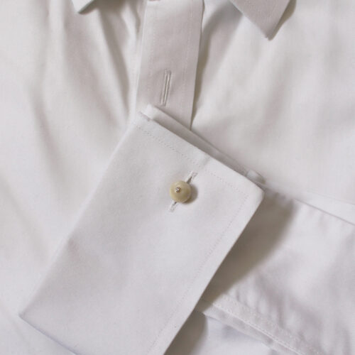 mother of pearl and diamond cufflink on shirt cuff