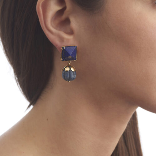 model wearing carved sodalite and lapis lazuli earring