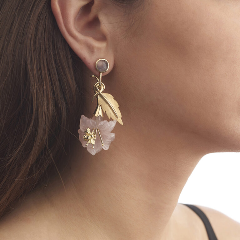 model wearing yellow gold and quartz flower and bee earrings
