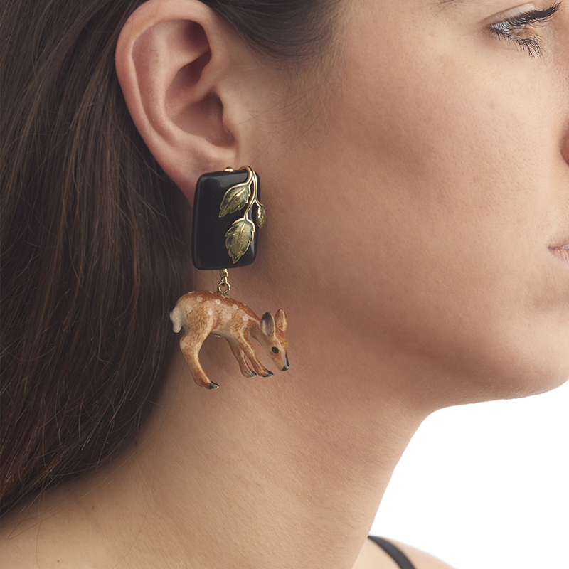 model wearing deer earring