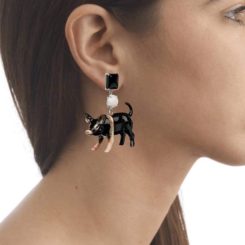 model wearing pig earring