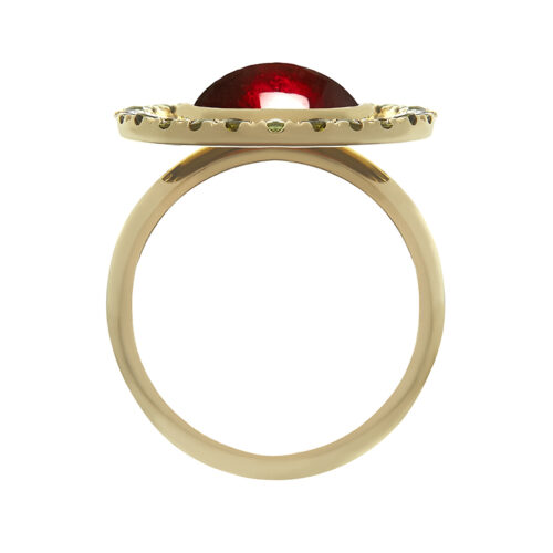 side view of gold and garnet cocktail ring