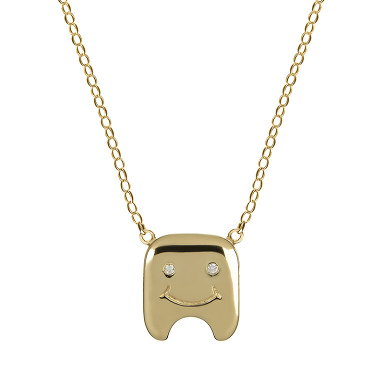 yellow gold plated necklace with in the shape of a tooth with diamond eyes