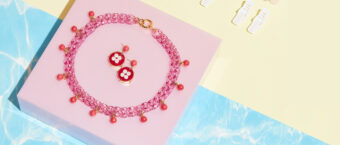 pink plastic chain necklace and earrings