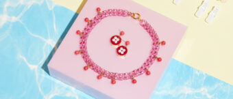 pink plastic chain necklace and earrings