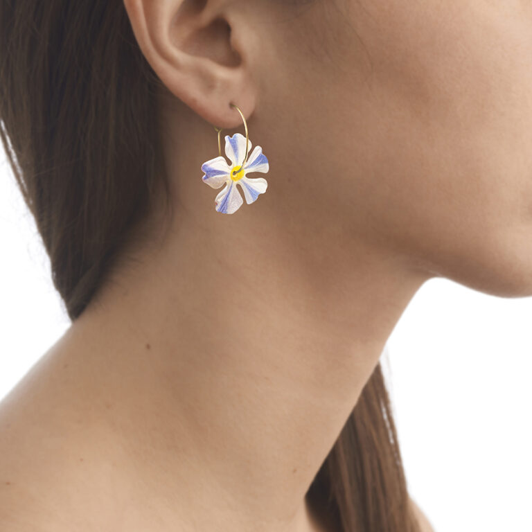 model wearing hoop flower earrings
