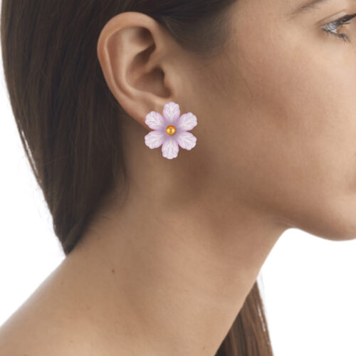 purple flower earrings on model