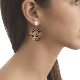 large disc earrings on model